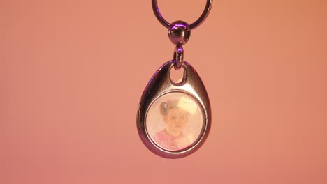 close up of the hanging child's photo in metal souvenir keychain