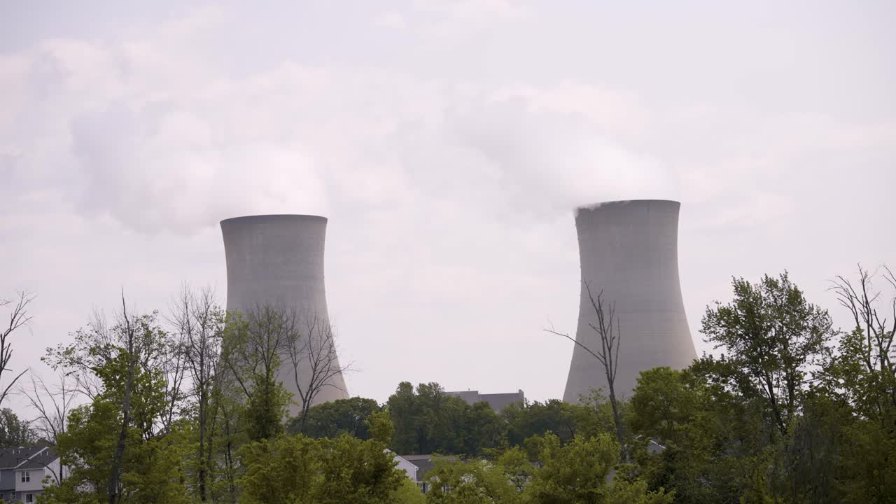 Nuclear Power Plant on a warm cloudy day with steam rising - close up