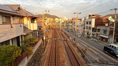 train tracks next to a highway road in onomichi hiroshima prefecture