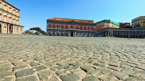 cobblestone street with historic buildings in naples