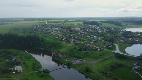 aerial view of a russian village by a river