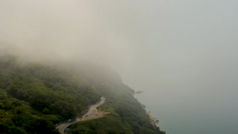 foggy clouds above the coast of budva in montenegro