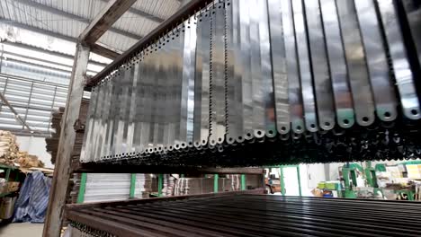 many tree cutting saw blade hang on rack, close up