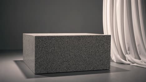 gray granite cube display stand with white curtain