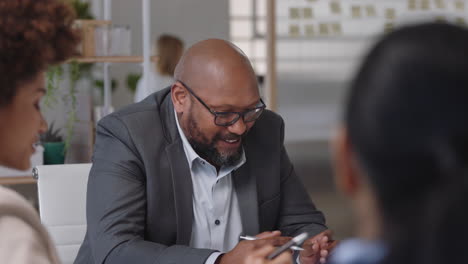 african-american-businessman-sharing-creative-ideas-for-startup-project-team-leader-meeting-with-colleagues-discussing-corporate-strategy-in-office-boardroom