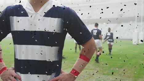 animation of black confetti falling over caucasian male rugby player