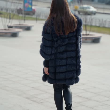 woman posing on street in city