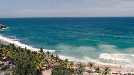 Aerial-Shot-pan-left-Beach-Bay---Aragua-Venezuela,Truck-Left-Along-Beach