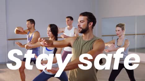 Animation-os-stay-safe-text-over-people-exercising-in-fitness-class