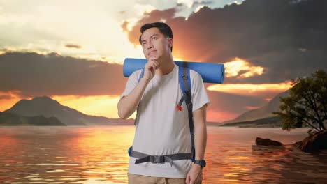 asian male hiker with mountaineering backpack thinking about something and looking around at a lake