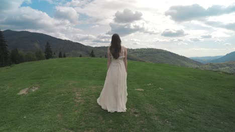 woman in a dress on the mountain