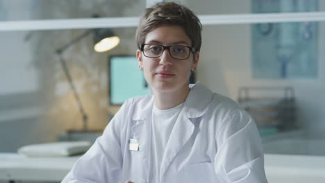 scientist in lab coat working at desk