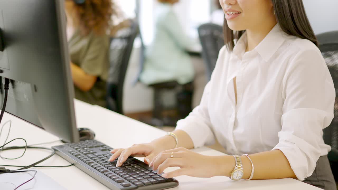 Hands of an asian woman using computer in a coworking