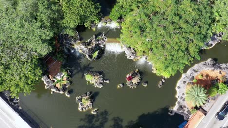 an aerial view directly above man-made waterfalls at the entrance of an apartment complex in lauderdale lakes, florida