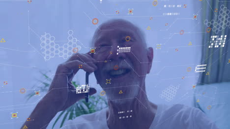 senior man making smartphone call in home office, showing floating hexagon nodes and data grid tech