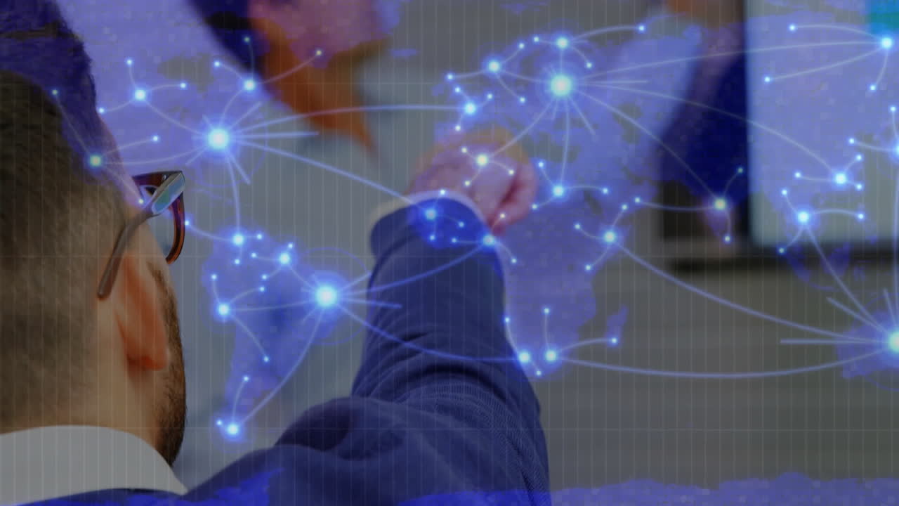 Hand reaching towards glowing network connections over world map animation