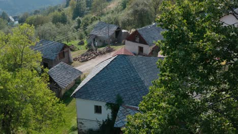 traditional slate stone tiling roof on old european rural cottage buildings