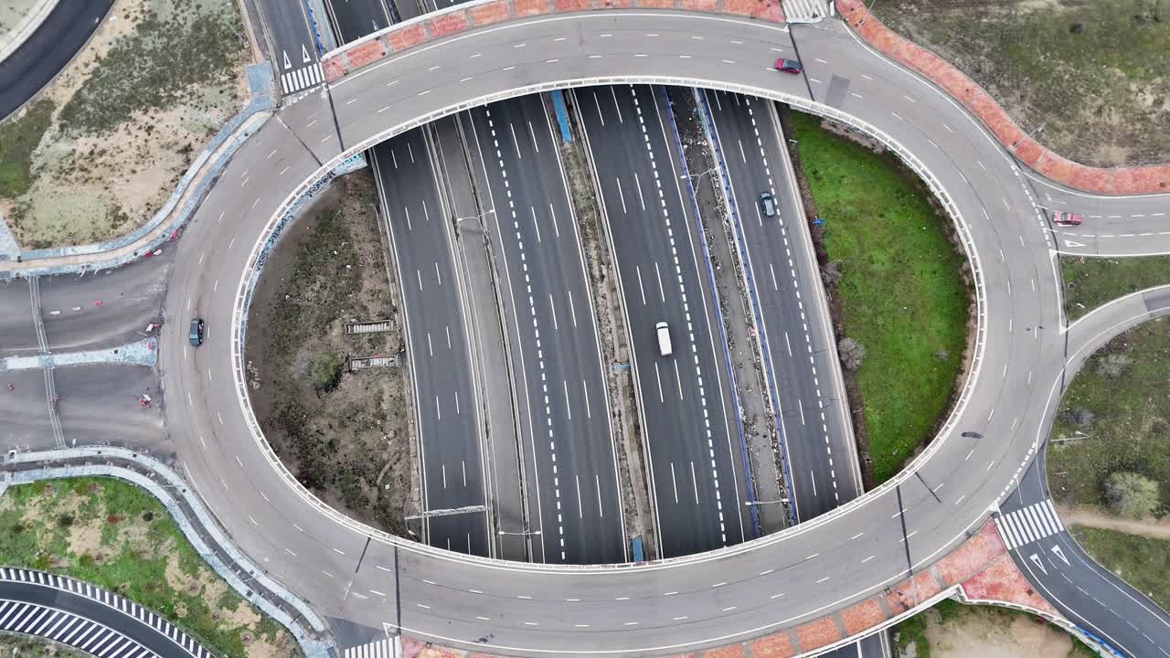 Stationary drone view of Madrid highway with roundabout