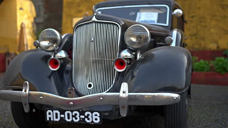 classic 1930s car in a city street