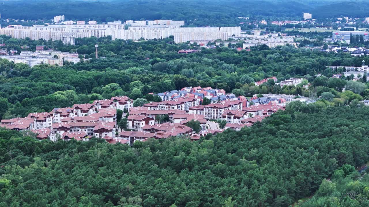 Aerial View of a Residential Area Surrounded by Forest