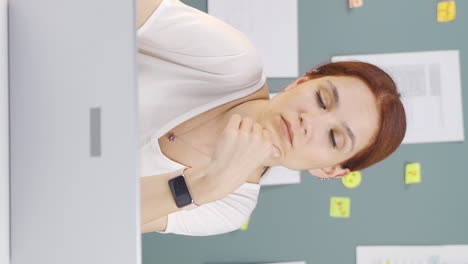 vertical video of woman looking at laptop is thoughtful.