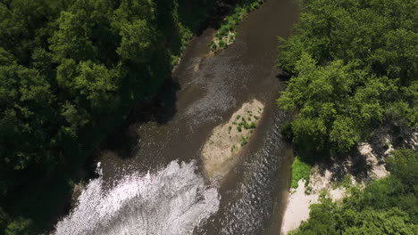 aerial bird's eye view shot of zumbro river in oronoco, minnesota, dolly out