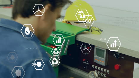 male technician leaning over workbench in engineering lab, showing hex overlays of co? charts