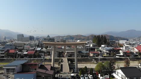 Japan-Shinto-Shrine-in-the-middle-of-town-Aerial-Drone-120fps