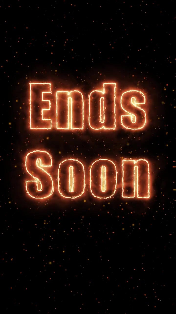 Orange glowing text appears on a black background with subtle floating sparks and vertical orientation