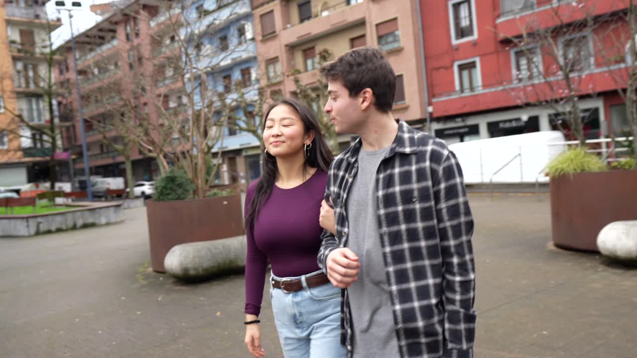 Couple walking in the city and kissing