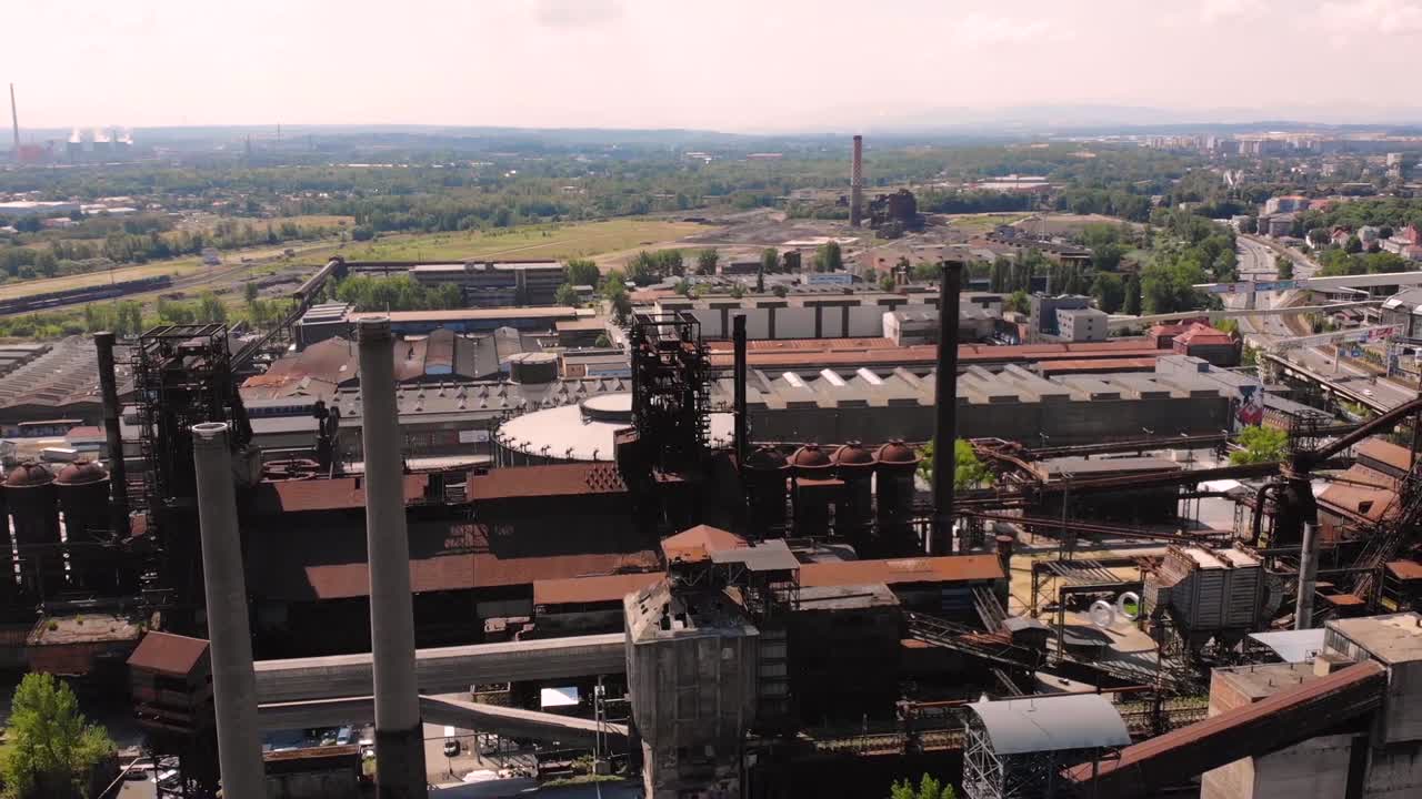 Dolni Oblast Vitkovice Industrial zone aerial drone fly backward industrial historic complex  of coal mine, ironwork reveal. Ostrava, Czech republic