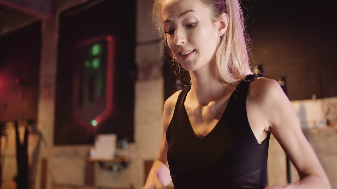 Determined Slim Young Woman Training Arms And Biceps With Resistance Band In Gym 1