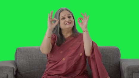 Happy-Indian-old-woman-showing-okay-sign-Green-screen