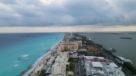 Aerial-View-of-a-small-island-surrounded-by-blue-clear-water-in,-Cancun-Mexico