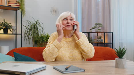 happy senior old woman involved in pleasant conversation phone call good news enjoy talking gossip