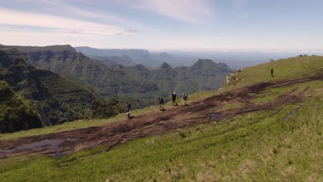 mens hiking on the edge of the canyon