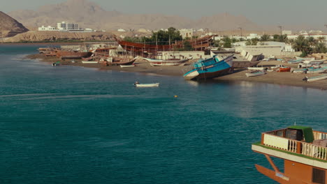 coastal boat building and repair yard in a sunny bay
