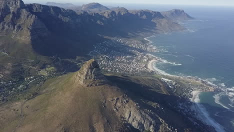 aerial: lion's head is a mountain tusk rising high above cape town, za