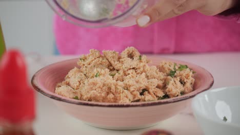 cooking, preparing a mixture for making fresh crab cakes