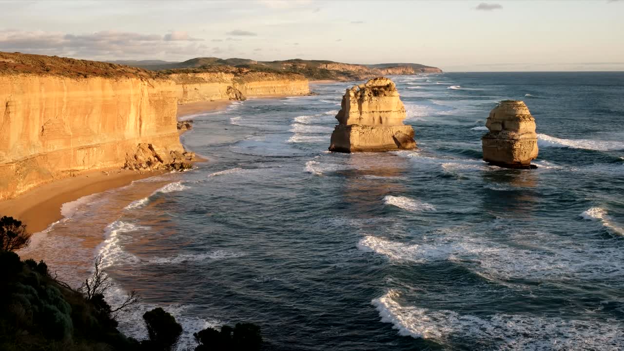 tilt down view of the twelve apostles at sunset looking east