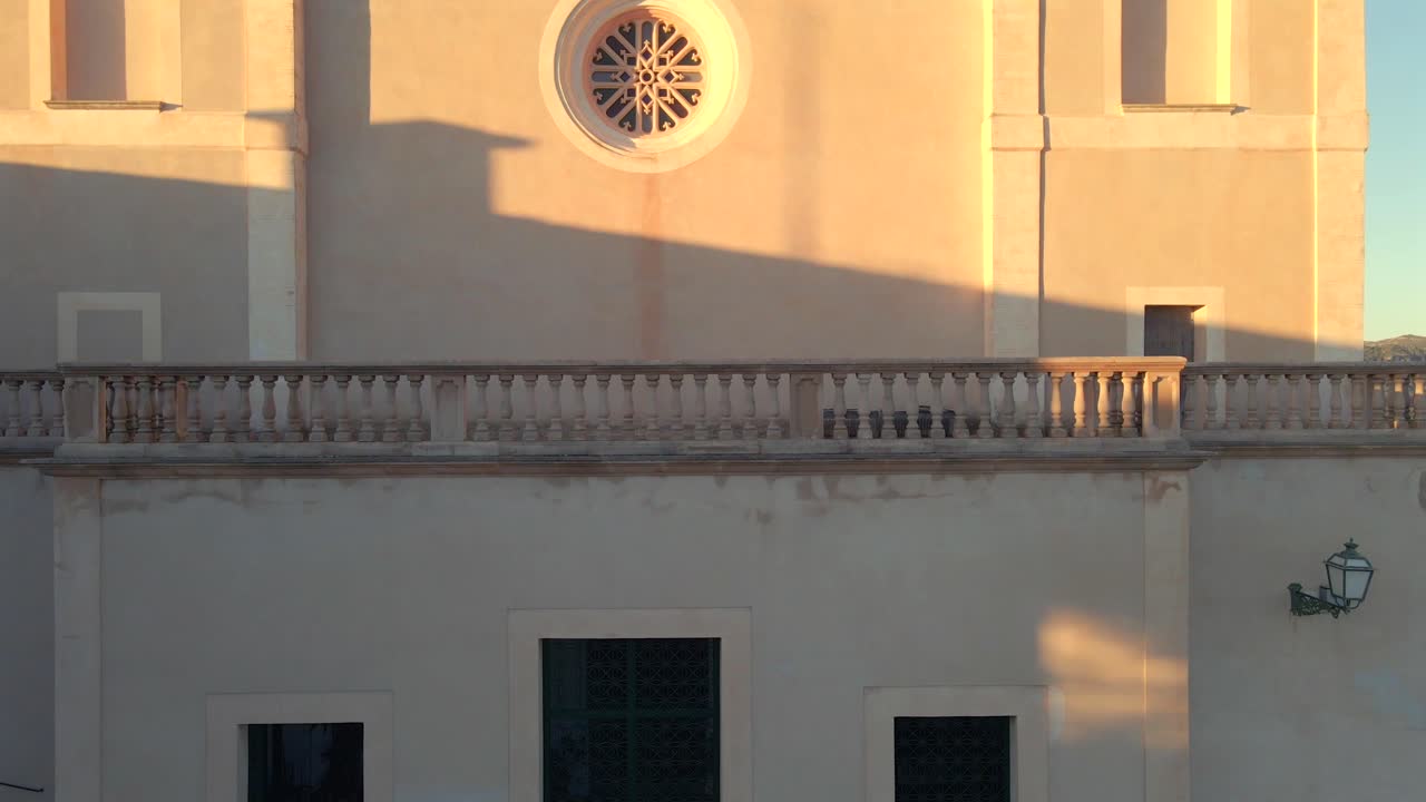 Discover the enchanting well and charming architecture of Arta, Mallorca as the golden hour casts a warm glow. Experience the tranquil beauty of this historic location.