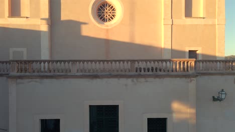 discover the enchanting well and charming architecture of arta, mallorca as the golden hour casts a warm glow. experience the tranquil beauty of this historic location.