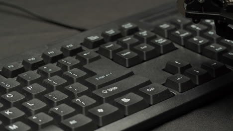 robot arm operating a keyboard