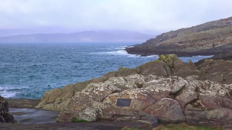 bantry bay west cork remote swimming spot with the mountains in mist on the far side of the bay on a winter morning