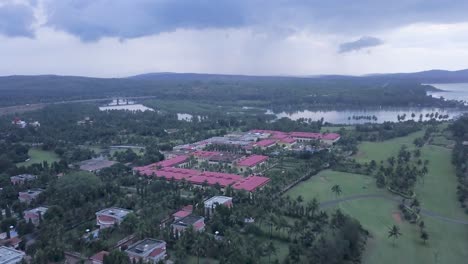 aerial view of the lalit golf and spa resort in raj baga, palolem, canacona, goa, india - aerial drone shot