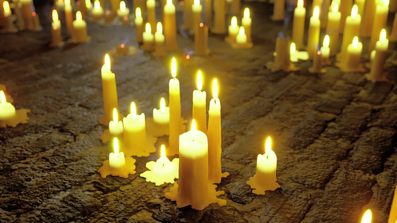 Flickering candles illuminate a serene space during a tranquil gathering