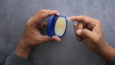 applying lip balm or ointment