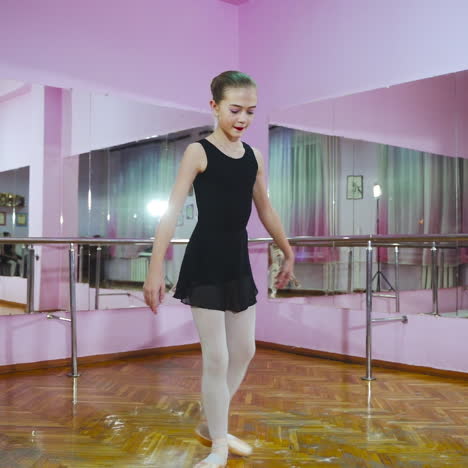 ballerina. girl dancer in ballet school learns to dance. slow motion