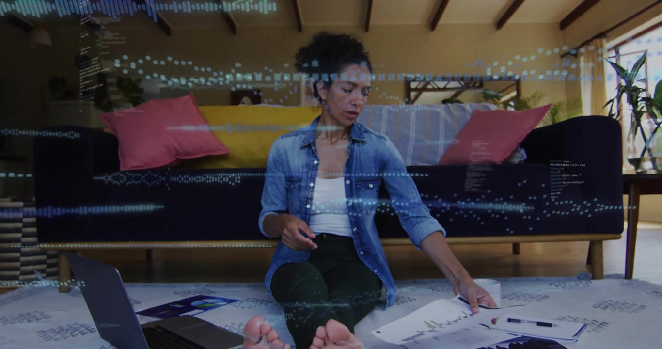 Woman reading bill by laptop, waveform code overlays spreading while sorting papers for business