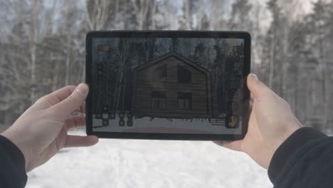 wooden cabin under construction in a snowy forest